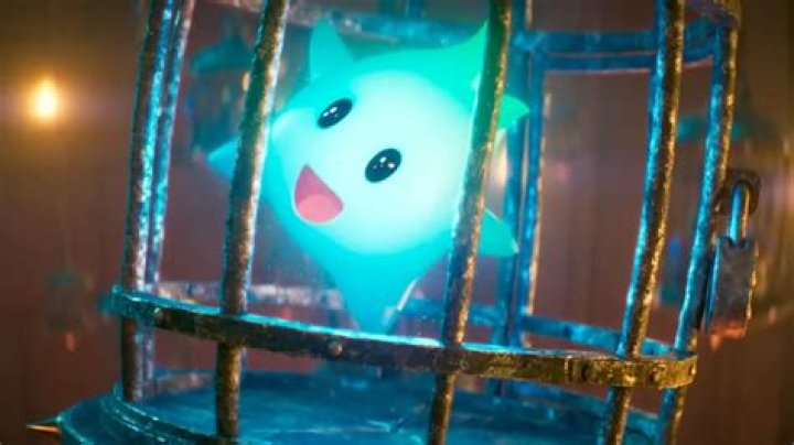A Luma from Super Mario Galaxy bounces with glee while caged in Bowser&rsquo;s castle dungeon in a still from The Super Mario Bros. Movie