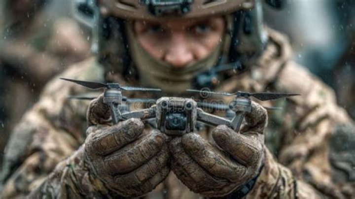 A Operator holds up a gun for the Champion&rsquo;s Domination in Modern Warfare 3