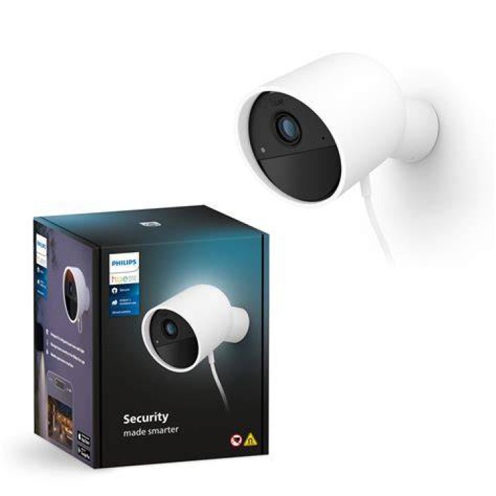 a round white security camera attached to a pole