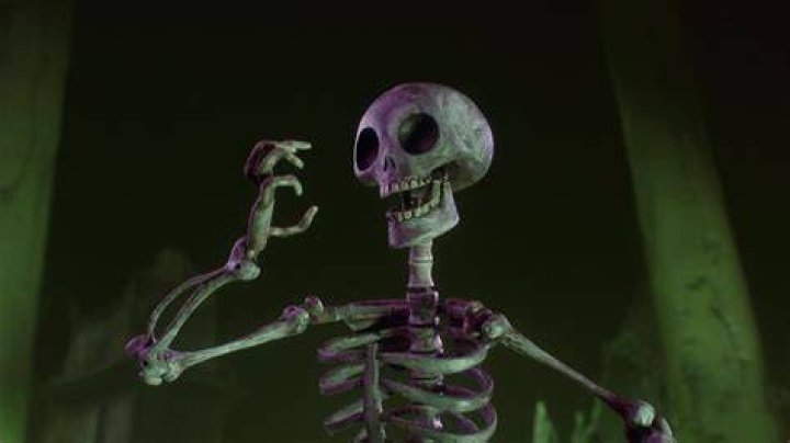 A screencap from 2013&rsquo;s Corpse Grinders 3 shows a blurry outline of a black cat leaping on top of a bent-over biker, with a motorcycle dominating the foreground