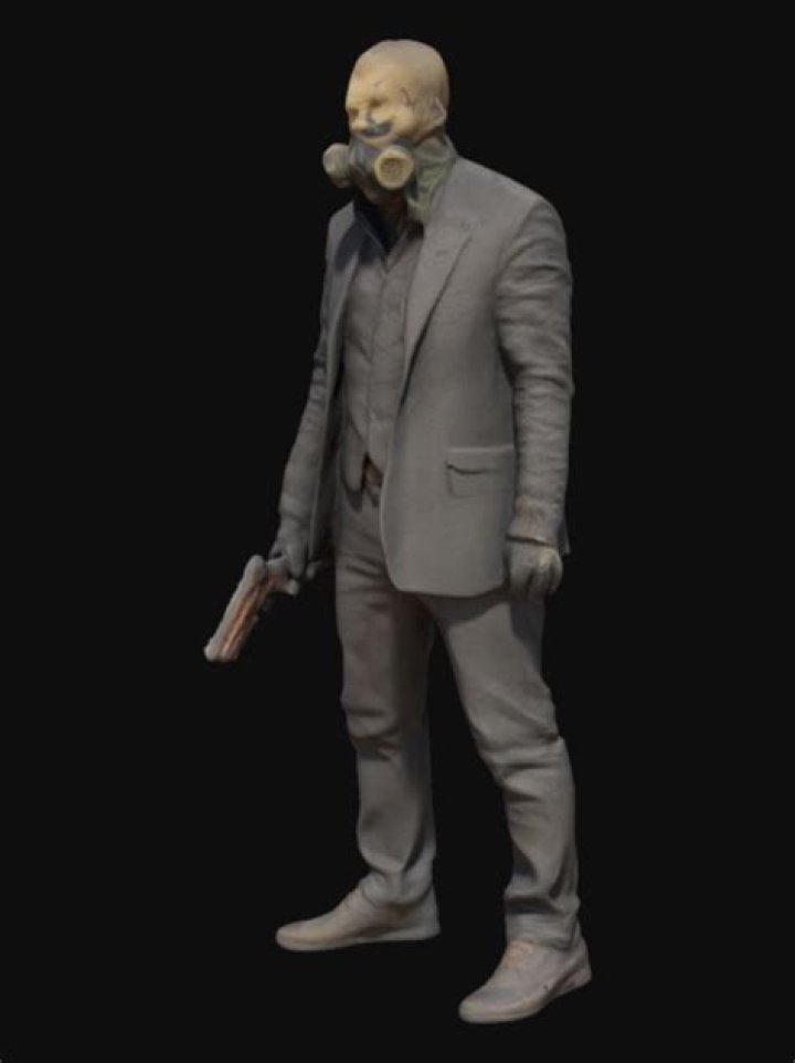 Agent 47 stands in front of a glass case of hunting rifles in Dartmoor in Hitman 3