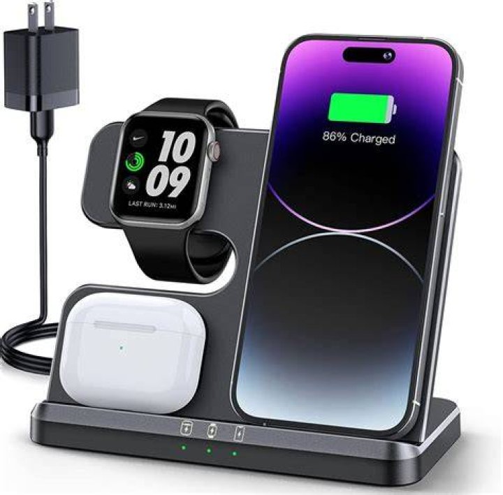 Dark iPhone charging on purple surface