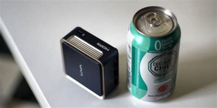 ecs q1d mini pc ultra tiny towered over by soda