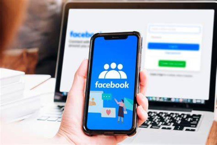 phone screen with a Facebook icon with a red notification icon