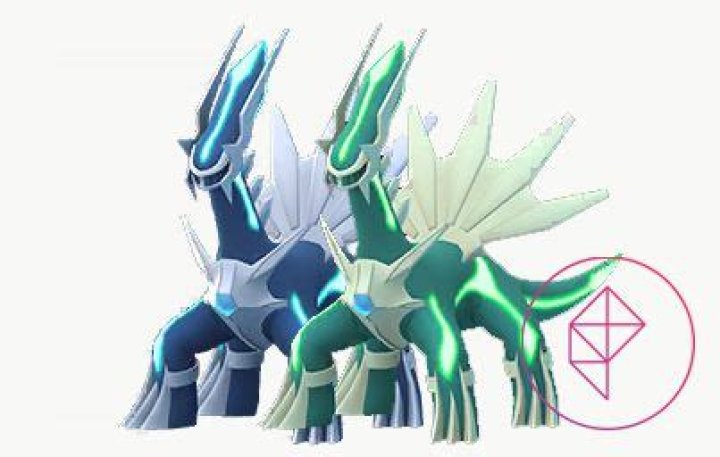 Shiny and regular Dialga. Shiny Dialga is a teal green with bright green accents.