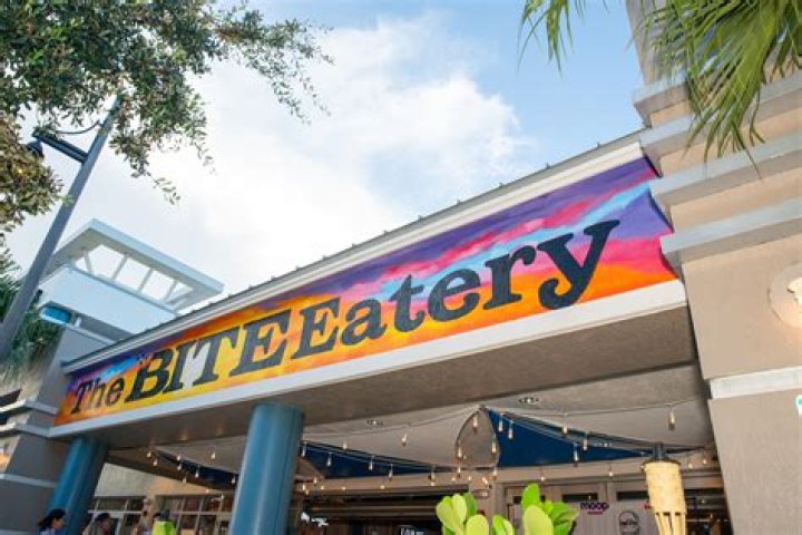 The Bite Eatery, Pompano Beach's first food hall, is scheduled to have a grand opening on March 27. This overturned boat with market lights is suspended next to The Bite Bar, the centerpiece of the food hall.
