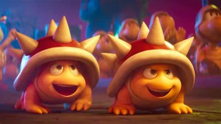 Two smiling Spinys stare up at Bowser in a still from The Super Mario Bros. Movie.