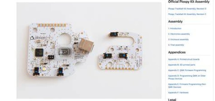 Two white colored PCBs from the Ploopy trackball mouse.
